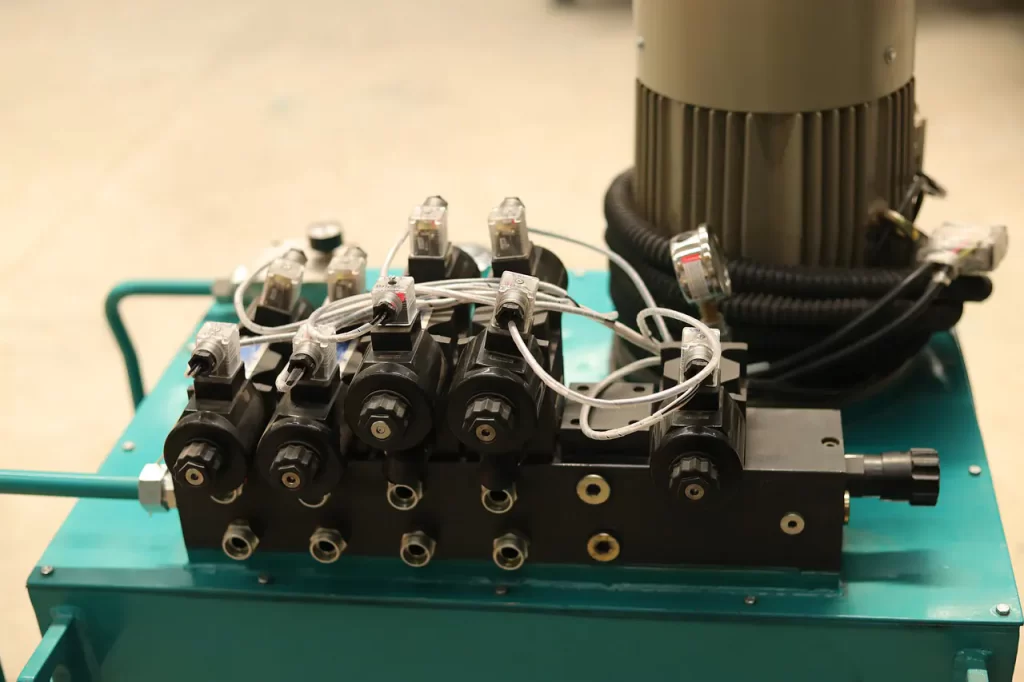 View of Hydraulic oil reservoir with electric motor solenoid valves